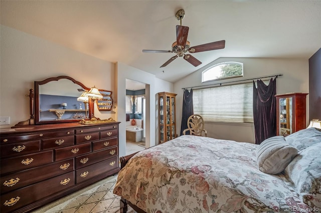 bedroom featuring vaulted ceiling, ceiling fan, and connected bathroom