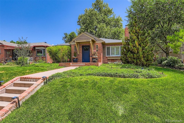 1224 Glencoe St, Denver, CO 80220 - view of front facade with brick siding, a chimney, and a front lawn