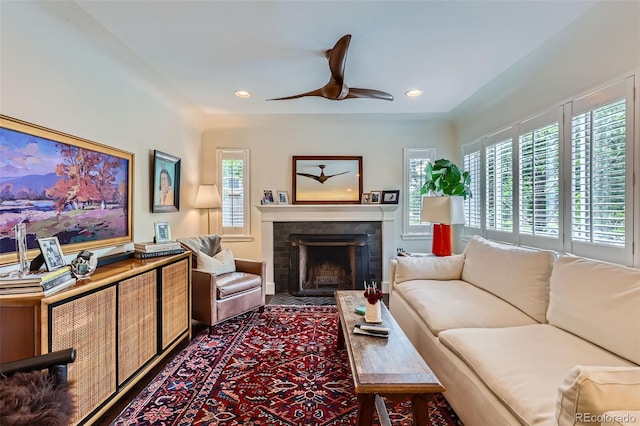 1224 Glencoe St, Denver, CO 80220 - living room featuring a ceiling fan, a fireplace, and recessed lighting