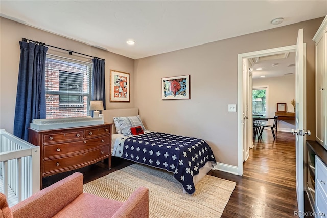 1224 Glencoe St, Denver, CO 80220 - bedroom featuring wood finished floors, multiple windows, and recessed lighting