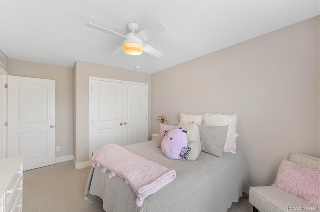 12845 Park Creek Way, Firestone, CO 80504 - bedroom featuring light colored carpet, a closet, ceiling fan, and baseboards