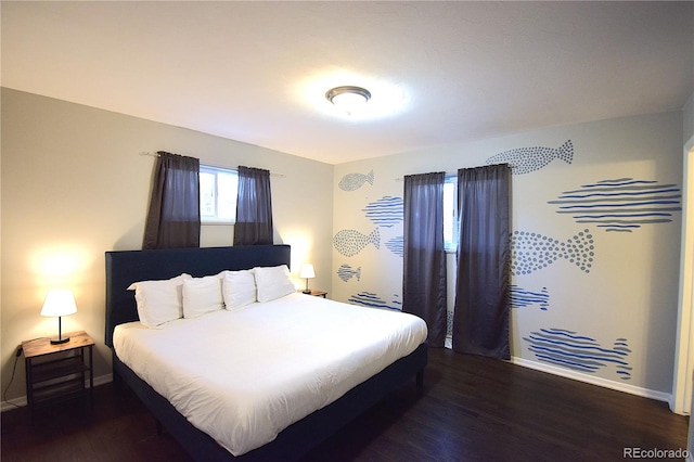 bedroom featuring dark hardwood / wood-style flooring