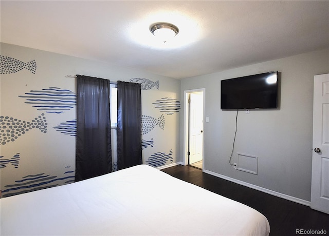 bedroom featuring dark hardwood / wood-style floors