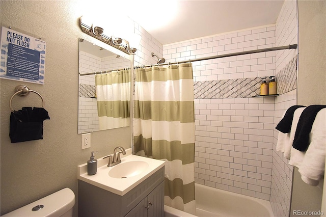 full bathroom with vanity, toilet, and shower / tub combo