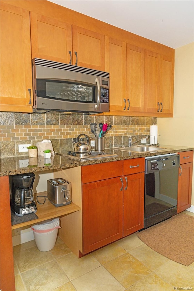 580 Winter Park Dr # 4571-4573, Winter Park, CO 80482 - kitchen featuring black dishwasher, brown cabinets, stainless steel microwave, and backsplash