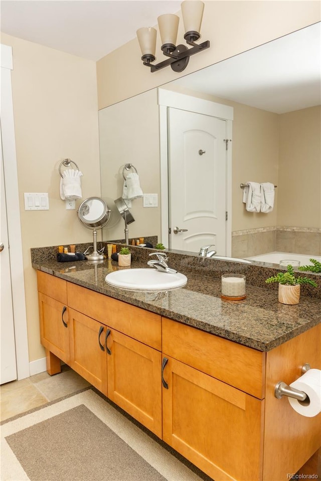 580 Winter Park Dr # 4571-4573, Winter Park, CO 80482 - bathroom with a notable chandelier and vanity