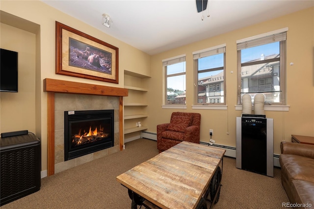 580 Winter Park Dr # 4571-4573, Winter Park, CO 80482 - carpeted living room with a tiled fireplace, built in shelves, and baseboard heating