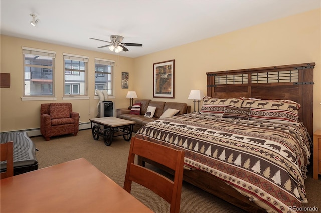 580 Winter Park Dr # 4571-4573, Winter Park, CO 80482 - carpeted bedroom featuring baseboard heating, baseboards, and a ceiling fan