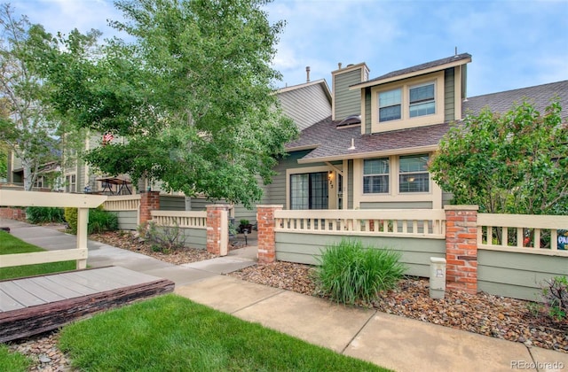 725 Crown Point Dr, Colorado Springs, CO 80906 - view of front of home with roof with shingles and a fenced front yard