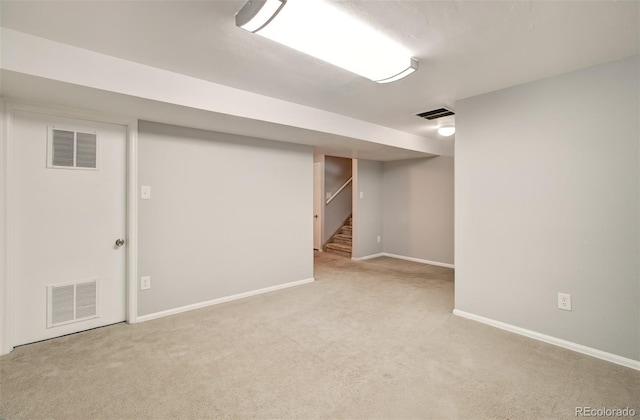 725 Crown Point Dr, Colorado Springs, CO 80906 - finished basement with carpet floors, baseboards, and stairway