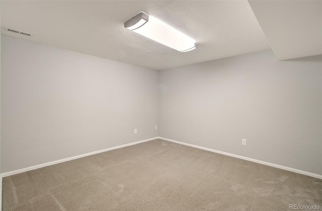 725 Crown Point Dr, Colorado Springs, CO 80906 - spare room featuring carpet and baseboards