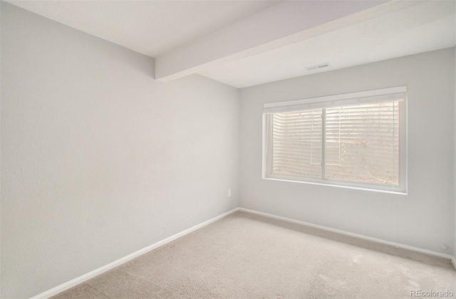 725 Crown Point Dr, Colorado Springs, CO 80906 - empty room featuring light colored carpet, baseboards, and beam ceiling