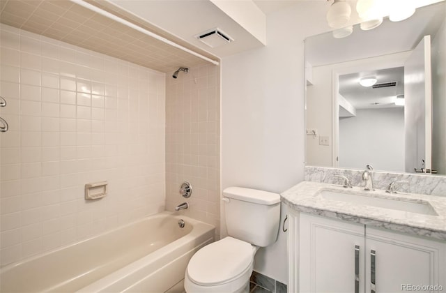 725 Crown Point Dr, Colorado Springs, CO 80906 - full bathroom with vanity, toilet, and shower / washtub combination