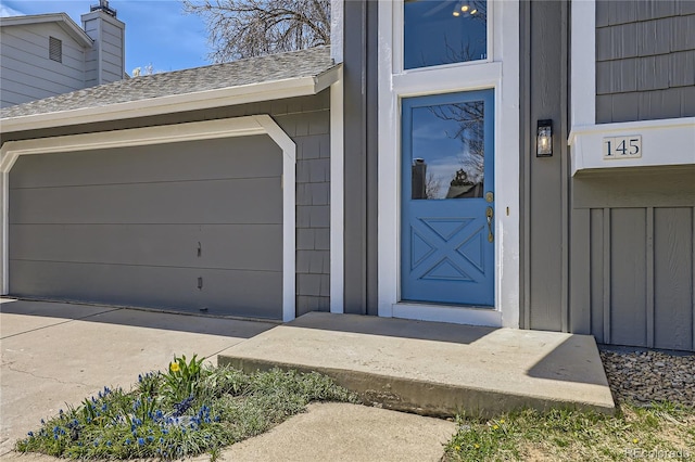 145 S Buchanan Ave, Louisville, CO 80027 - view of exterior entry with a shingled roof