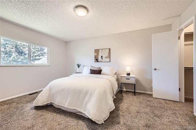 145 S Buchanan Ave, Louisville, CO 80027 - carpeted bedroom featuring a textured ceiling and baseboards
