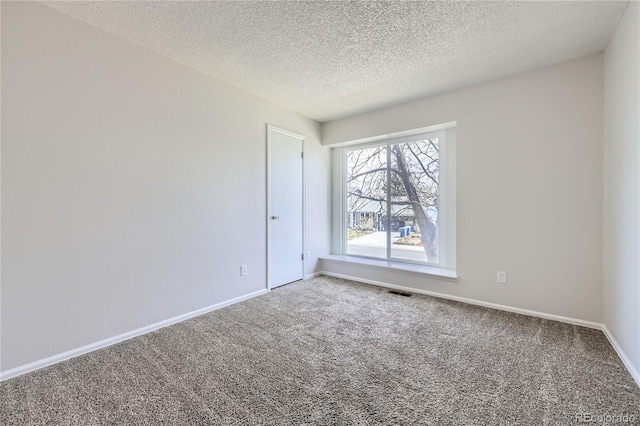 145 S Buchanan Ave, Louisville, CO 80027 - unfurnished room with carpet floors, baseboards, and a textured ceiling