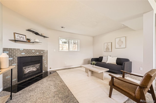 145 S Buchanan Ave, Louisville, CO 80027 - living area featuring a tiled fireplace and baseboards