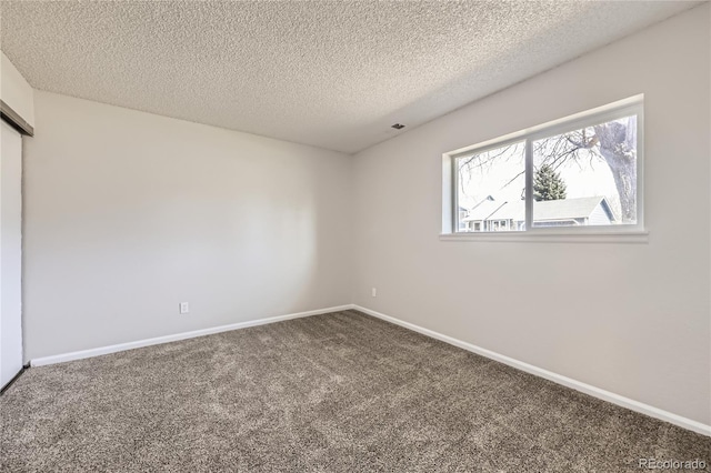 145 S Buchanan Ave, Louisville, CO 80027 - unfurnished bedroom featuring carpet floors, a textured ceiling, and baseboards