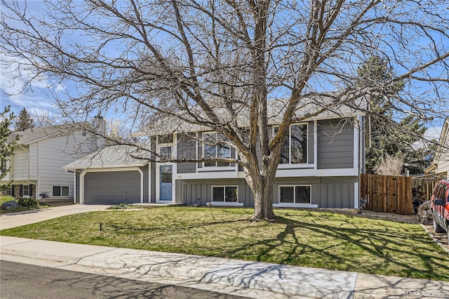 145 S Buchanan Ave, Louisville, CO 80027 - view of front of property with an attached garage, concrete driveway, and board and batten siding