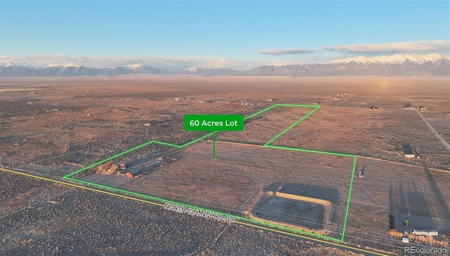 1374 N Rd 110, Mosca, CO 81146 - overview of rural landscape with a mountainous background and property boundaries highlighted
