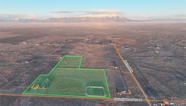 1374 N Rd 110, Mosca, CO 81146 - aerial overview of property's location featuring a mountainous background and property boundaries highlighted