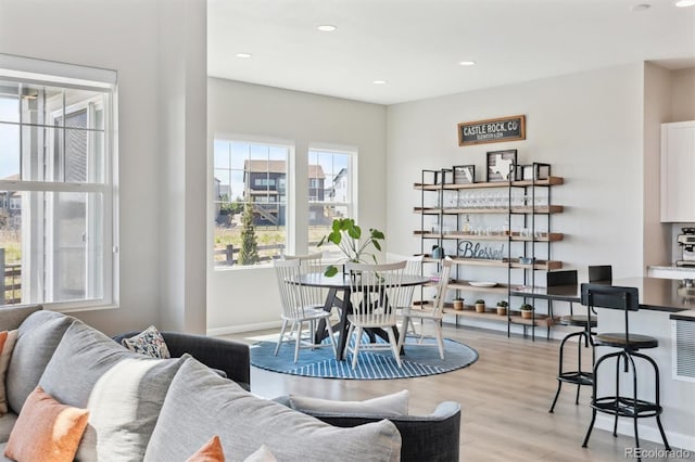 interior space with light wood finished floors, baseboards, and recessed lighting