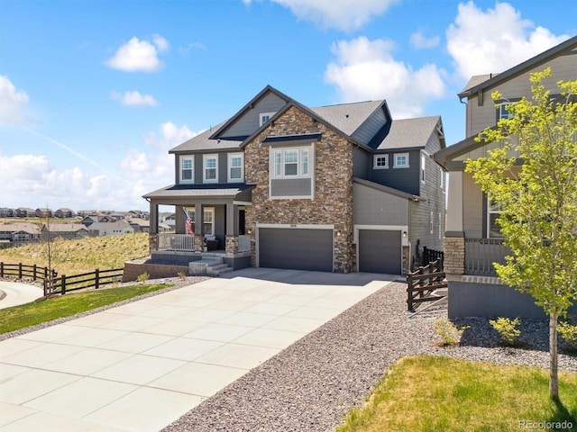 3038 Blithe Pt, Castle Rock, CO 80108 - craftsman inspired home with stone siding, concrete driveway, an attached garage, and covered porch