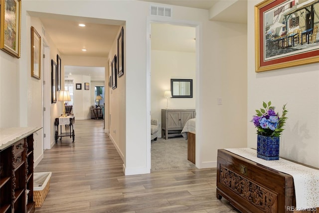 corridor featuring light hardwood / wood-style flooring