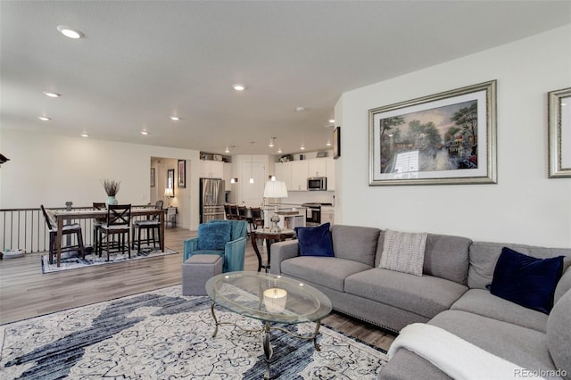 living room with light hardwood / wood-style floors