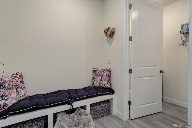 mudroom with light hardwood / wood-style floors