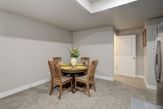 view of carpeted dining space