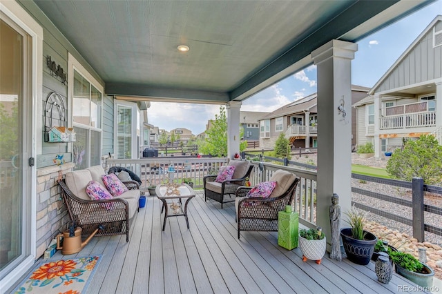 deck with an outdoor living space and a porch