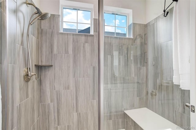 bathroom with a tile shower