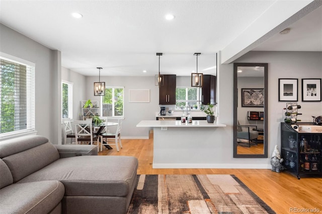 5125 Umatilla St, Denver, CO 80221 - living area with light wood-style flooring, recessed lighting, and baseboards