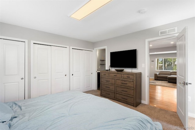 5125 Umatilla St, Denver, CO 80221 - bedroom featuring multiple closets, carpet floors, and baseboards