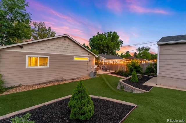 5125 Umatilla St, Denver, CO 80221 - yard at dusk with a patio