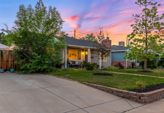 5125 Umatilla St, Denver, CO 80221 - view of front facade featuring a chimney