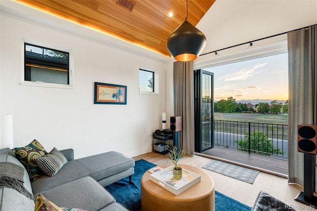 living room with vaulted ceiling, wooden ceiling, and light hardwood / wood-style floors