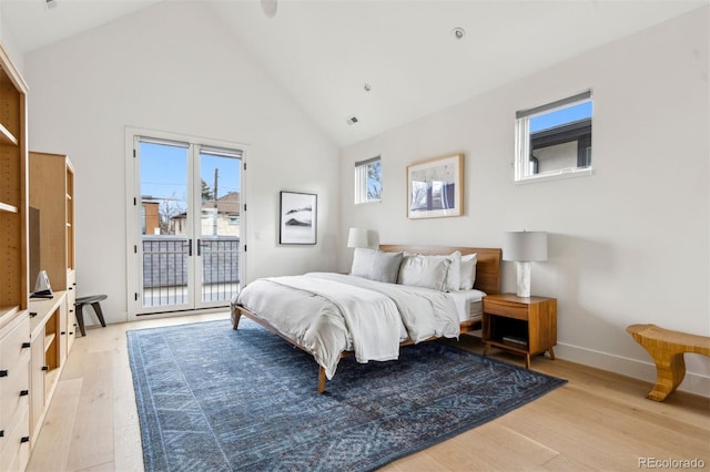 bedroom featuring access to outside, high vaulted ceiling, and light wood-type flooring