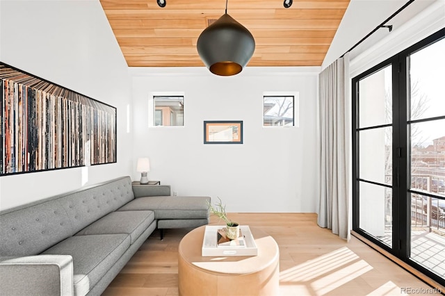 living area featuring light wood-style floors, wooden ceiling, and vaulted ceiling