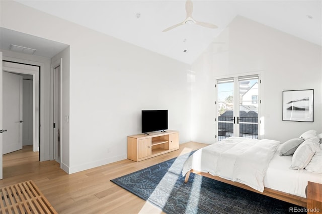 bedroom with access to exterior, light wood-style floors, ceiling fan, high vaulted ceiling, and baseboards