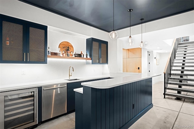 bar featuring wine cooler, a sink, stairs, stainless steel dishwasher, and pendant lighting