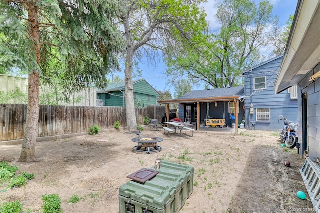 12 Arrawanna St, Colorado Springs, CO 80909 - fenced backyard with an outdoor fire pit and a patio