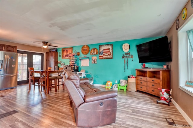 12 Arrawanna St, Colorado Springs, CO 80909 - living room with light wood finished floors, ceiling fan, and baseboards