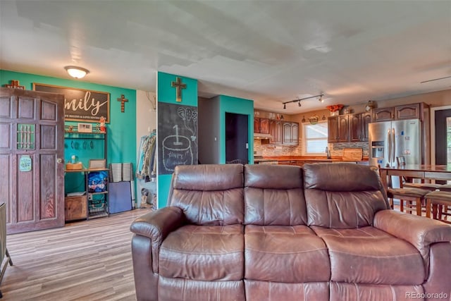 12 Arrawanna St, Colorado Springs, CO 80909 - living area with light wood-type flooring and rail lighting