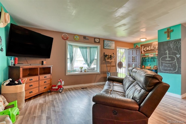 12 Arrawanna St, Colorado Springs, CO 80909 - living room featuring wood finished floors and baseboards
