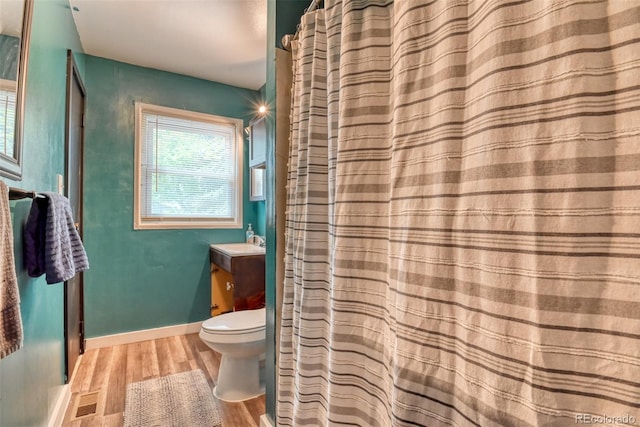 12 Arrawanna St, Colorado Springs, CO 80909 - bathroom featuring toilet, wood finished floors, vanity, and baseboards