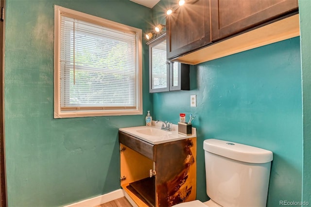 12 Arrawanna St, Colorado Springs, CO 80909 - bathroom with vanity, toilet, and baseboards
