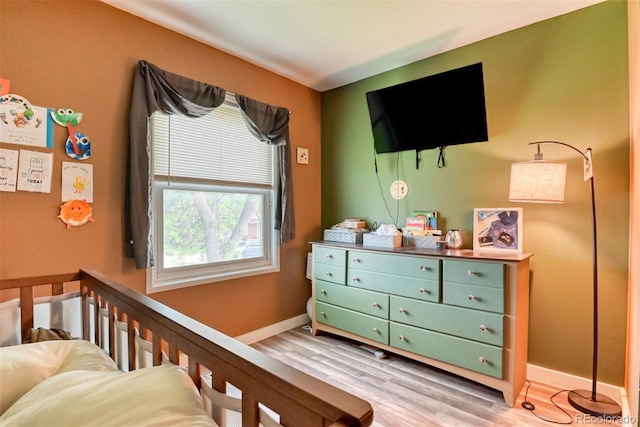 12 Arrawanna St, Colorado Springs, CO 80909 - bedroom with light wood-style floors and baseboards