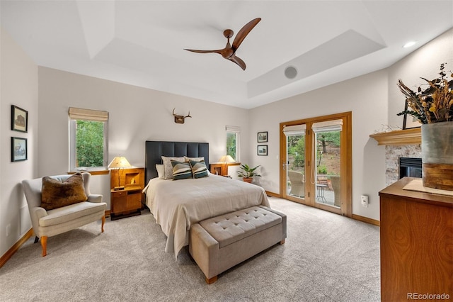 1999 Champions Cir, Castle Rock, CO 80104 - bedroom with a raised ceiling, access to exterior, light carpet, and multiple windows